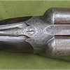 10-bore made circa 1877-80, and of a calibre once popular with wild fowl shooters. This gun with its 32 inch length damascus barrels weighs 8lbs and handles like a much lighter traditional side by side game gun weighing 6 to 7 lbs.